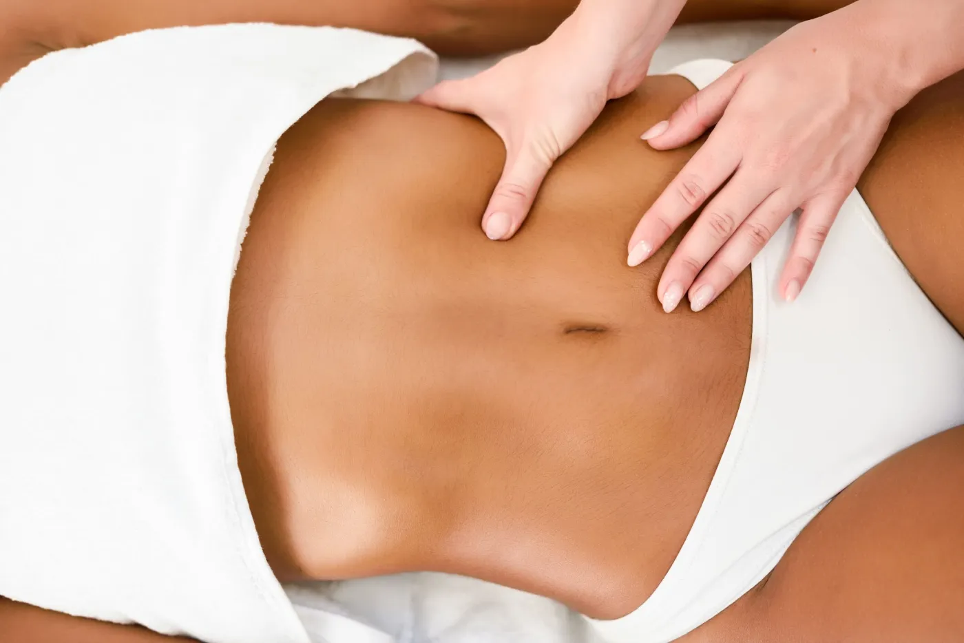 Body contouring massage on the abdomen
